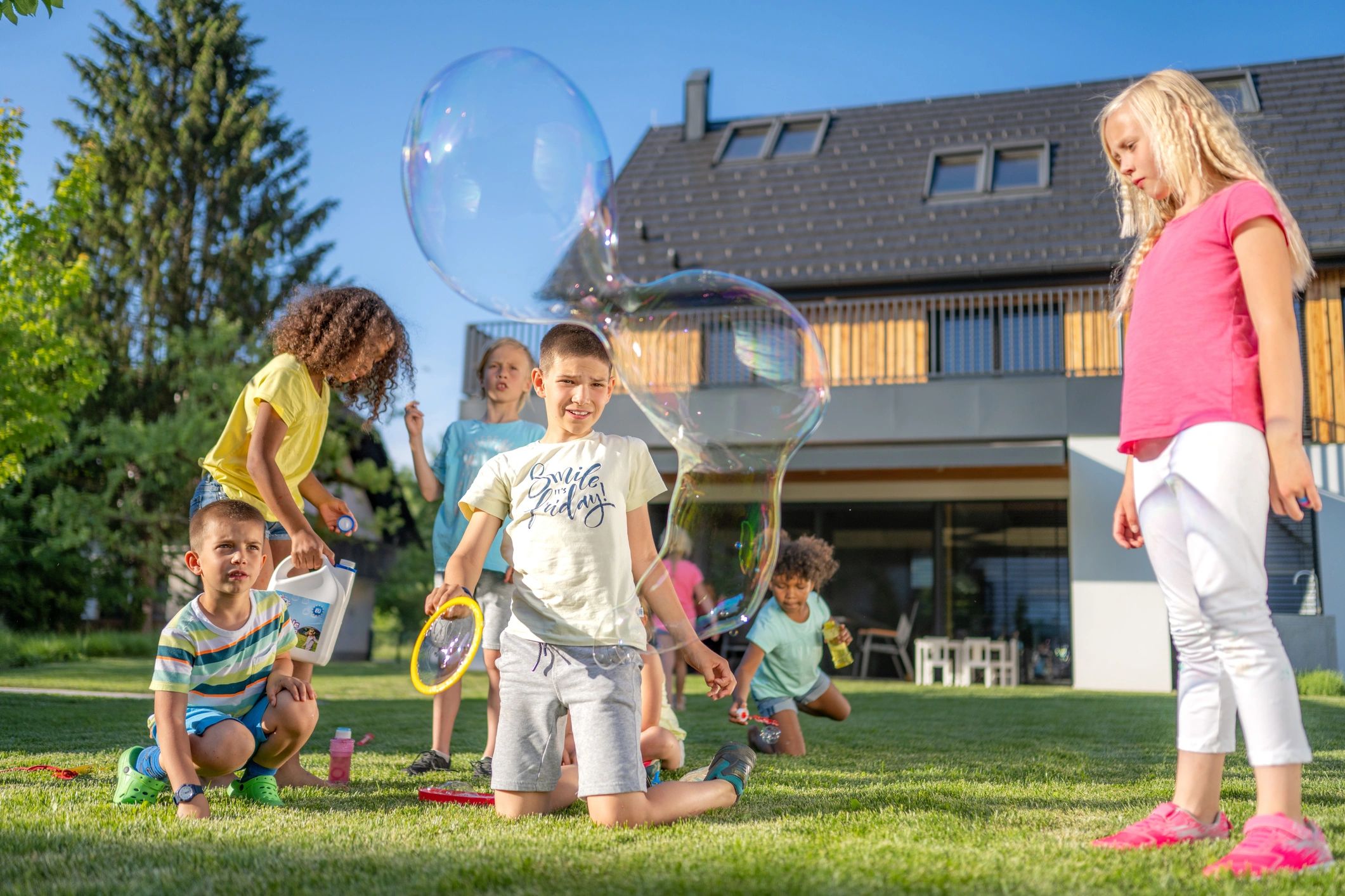 Children enjoying outdoor play on the grass