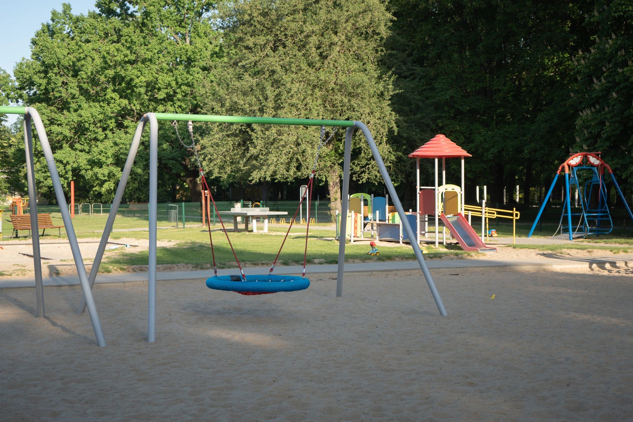 Outdoor play area with swing and open space for children