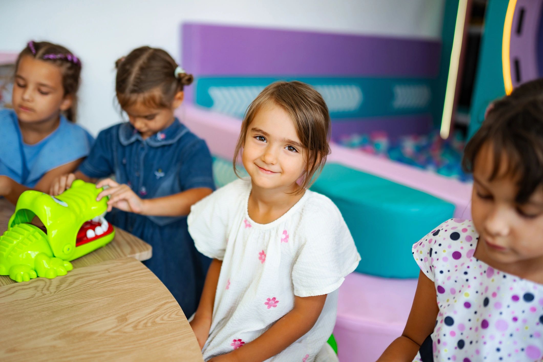 Children playing a learning game together indoors